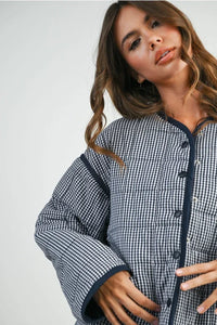 Buttoned quilted puffer jacket in blue and white checkered with navy trim