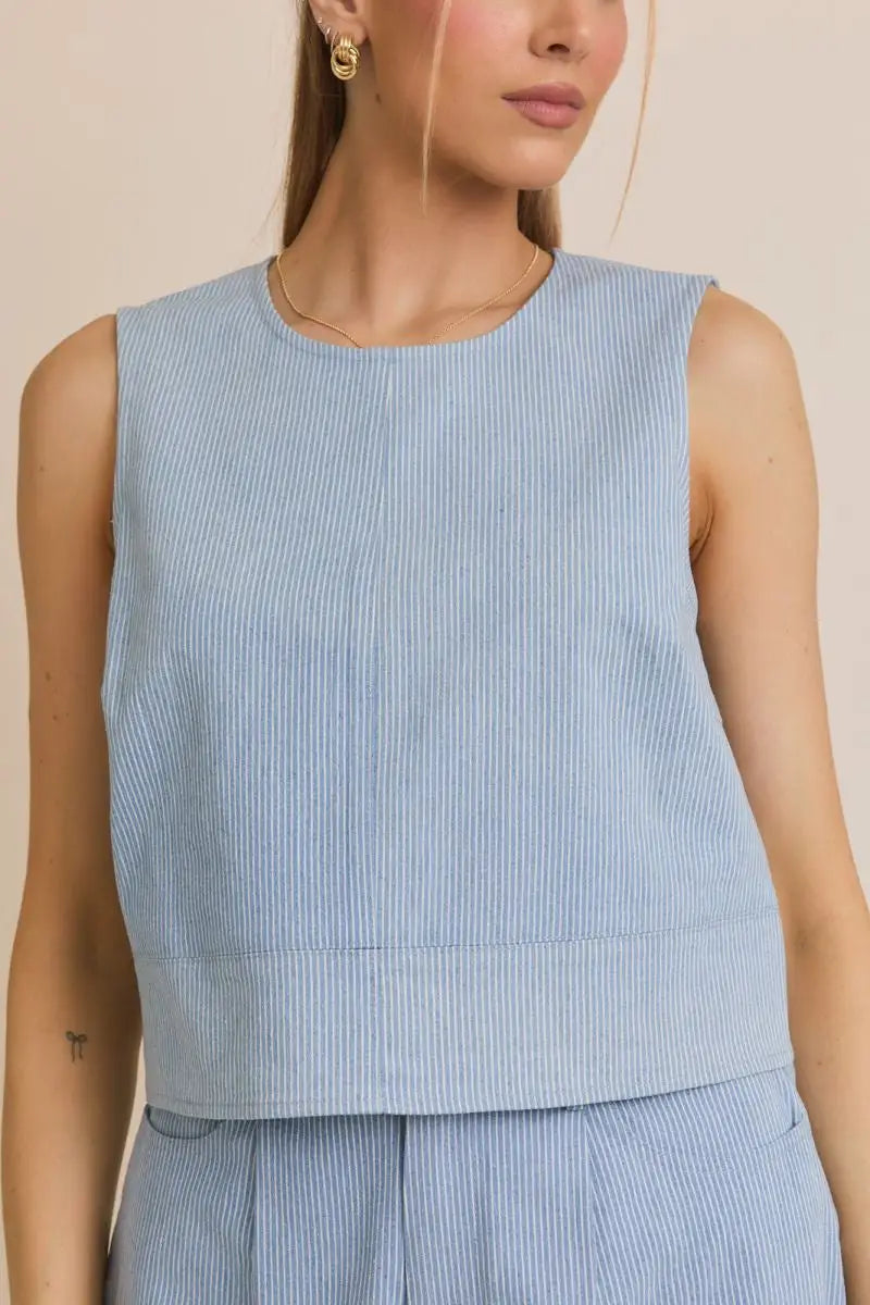 Blue and white striped sleeveless top from SLEEVELESS DENIM STRIPE TOP, perfect for women’s boho chic clothing at Shop Daisy
