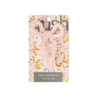 Blush pink Crush Very Demure Bow Hair Clip with floral packaging