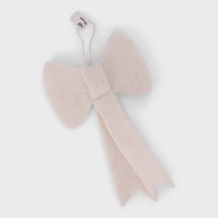 Blush pink velvet handmade white bow ornament with tag and ribbon tail from J.Crew