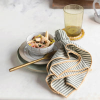 Bowl of fruit salad in a Debossed Stoneware Soup Bowl with gold spoon and beverage