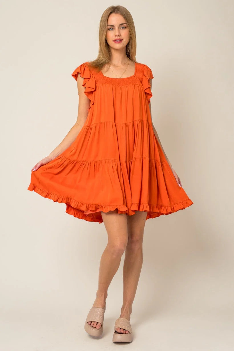 Bright orange ruffle sleeves tiered mini dress with flowy design and ruffled cap sleeves