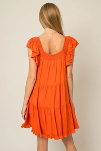 Bright orange ruffle sleeves tiered mini dress with a low back and ruffled sleeves