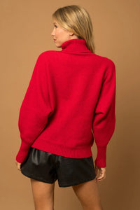 Bright red turtleneck sweater with voluminous sleeves from Shop Daisy, perfect for women’s boho chic clothing