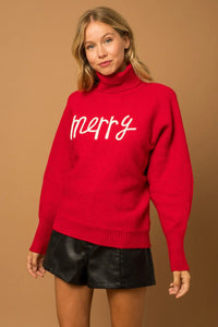 Bright red turtleneck sweater with merry script, perfect for women’s boho chic clothing