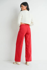 Bright red mini patch pocket wide-leg trousers paired with a white sweater