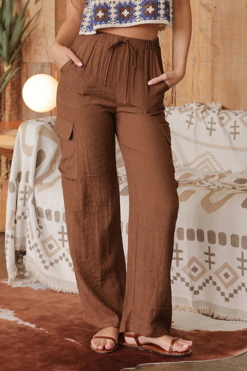 Loose-fitting brown wide leg drawstring cargo pants with pockets for comfort and style