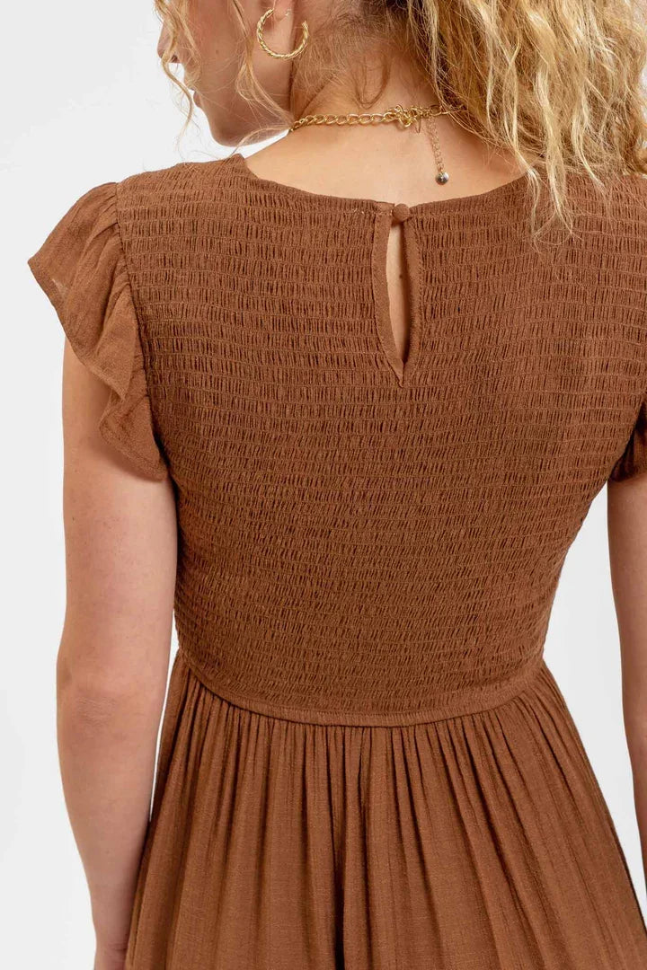 Brown Smocked Tiered Midi Dress featuring a smocked bodice and flowing skirt