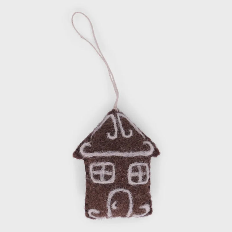 Handmade gingerbread house ornament in brown felt with white details