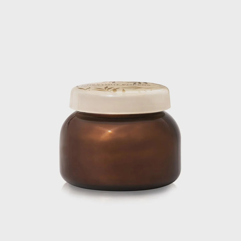 Brown glass jar with a patterned lid for Chestnut Embers Autumn Glow Candle Signature Jar