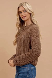 Brown crochet knit sweater featuring a loose weave, perfect for women’s boho chic clothing