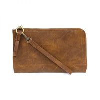 Tan leather clutch with wristlet strap from KARINA CONVERTIBLE WRISTLET & WALLET