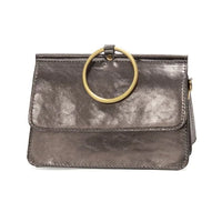Brown leather Aria Ring Bag with gold ring handle and interior zip compartments