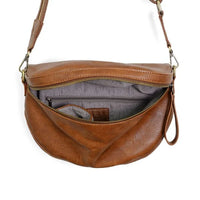 Brown leather LAURA CONTRAST STRAP sling belt bag showcasing open zipper and lining