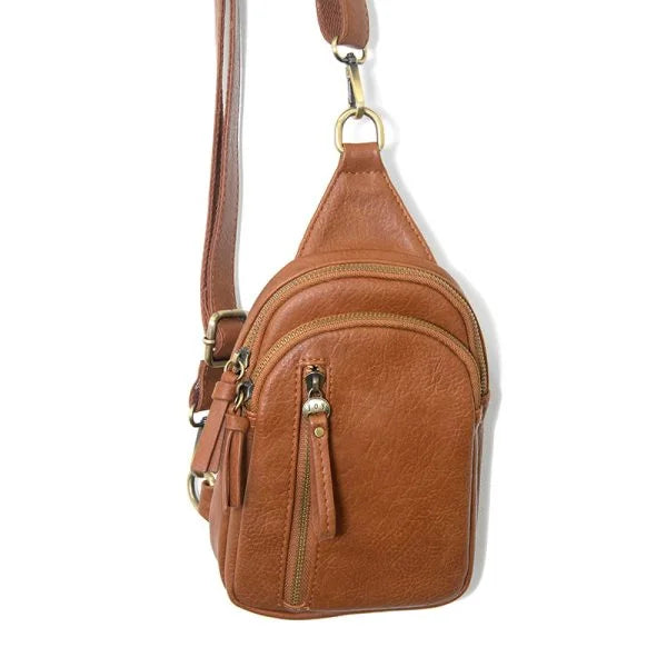 Brown leather SKYLER SLING BAG with gold hardware and floral embossing
