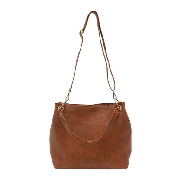 Brown leather handbag with shoulder and crossbody straps for women’s boho chic clothing