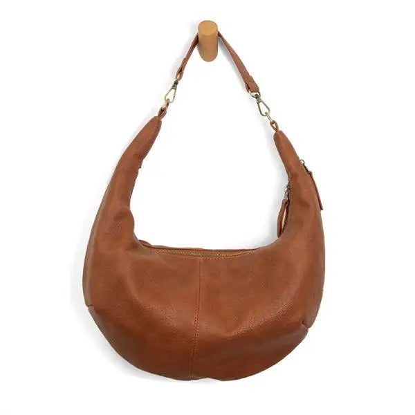 Brown leather hobo bag featuring a slouchy crescent design and short shoulder strap