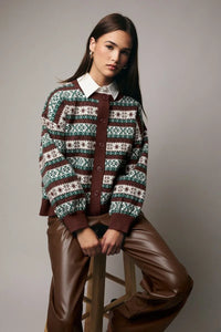 Brown leather pants with white collar shirt and round neck button-up graphic cardigan