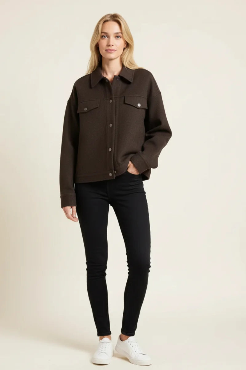 Brown Abela Jacket with white sneakers and black jeans, boho chic style
