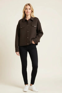 Brown Abela Jacket with white sneakers and black jeans, boho chic style