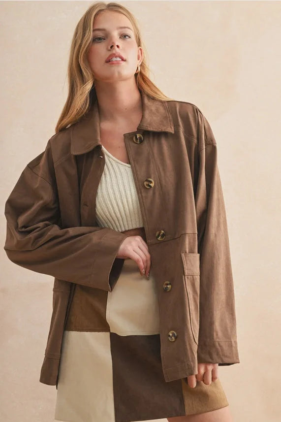 Brown suede button front oversized utility jacket with patch pockets. Shop Daisy women’s boho chic clothing