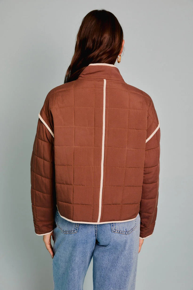 Brown drop shoulder high collared quilt jacket with white stripe accents and high collar