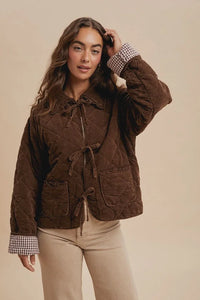 Garment washed quilted corduroy jacket with ruffled collar and ties for stylish wear