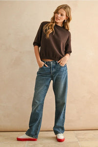 Brown short sleeve sweater top with three-quarter sleeves and ribbed hem