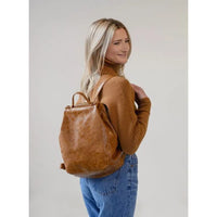Maggie Modern Backpack in brown vegan leather with adjustable shoulder straps and padded pocket