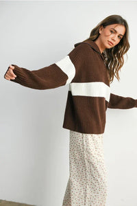 Brown and white striped long sleeve sweater with neck zip