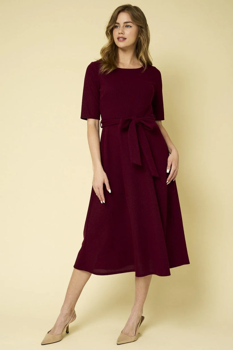 Burgundy midi dress with short sleeves and fitted waist from Shop Daisy’s women’s boho chic clothing