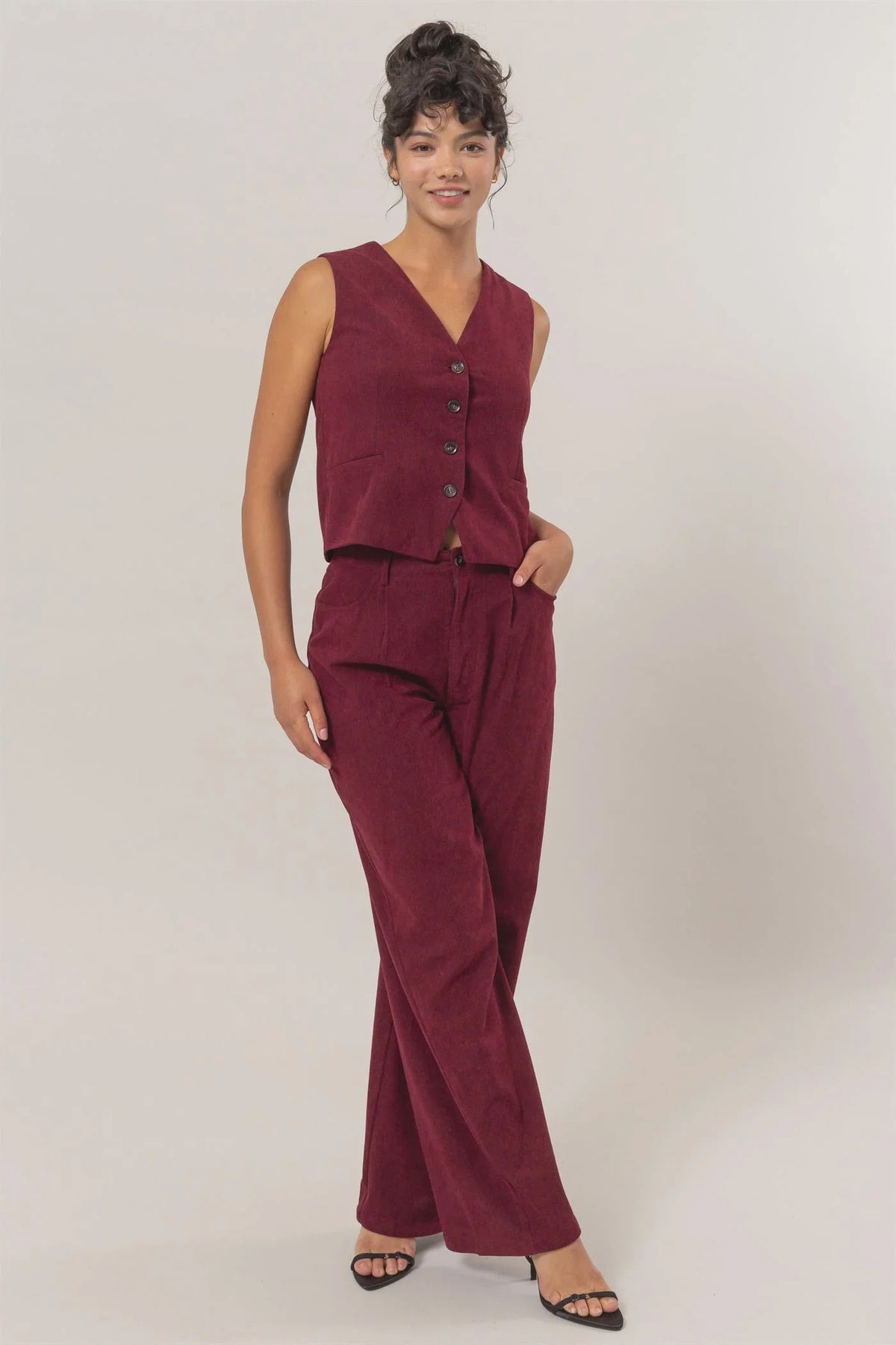 Burgundy sleeveless jumpsuit with button details, part of women’s boho chic clothing at Shop Daisy