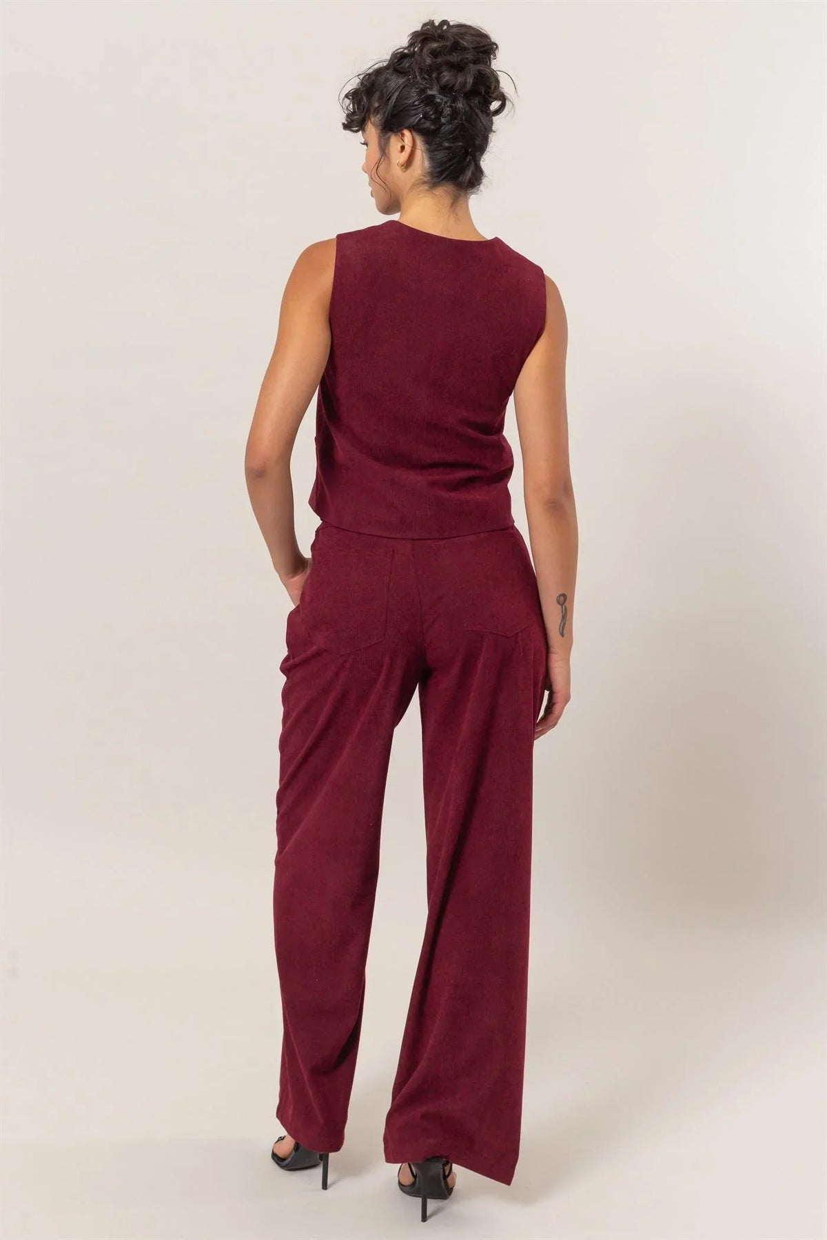 Burgundy sleeveless jumpsuit with wide-leg pants from Shop Daisy, ideal women’s boho chic clothing