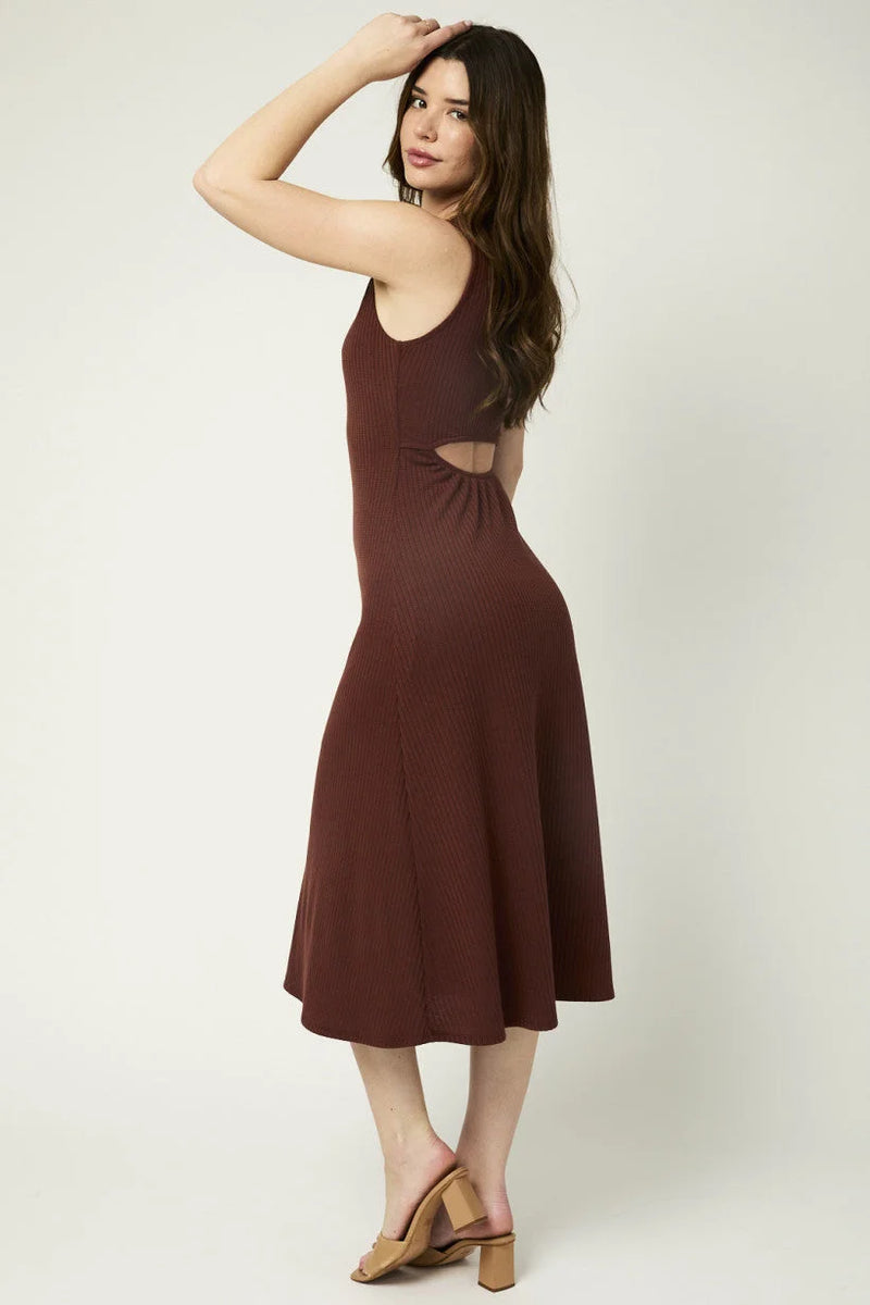 Burgundy sleeveless maxi dress with side cutouts, ideal for women’s boho chic clothing