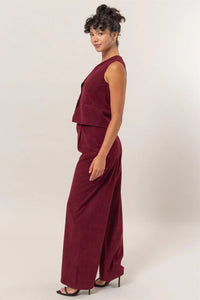 Burgundy sleeveless two-piece outfit featuring cropped top and wide-leg pants from Shop Daisy