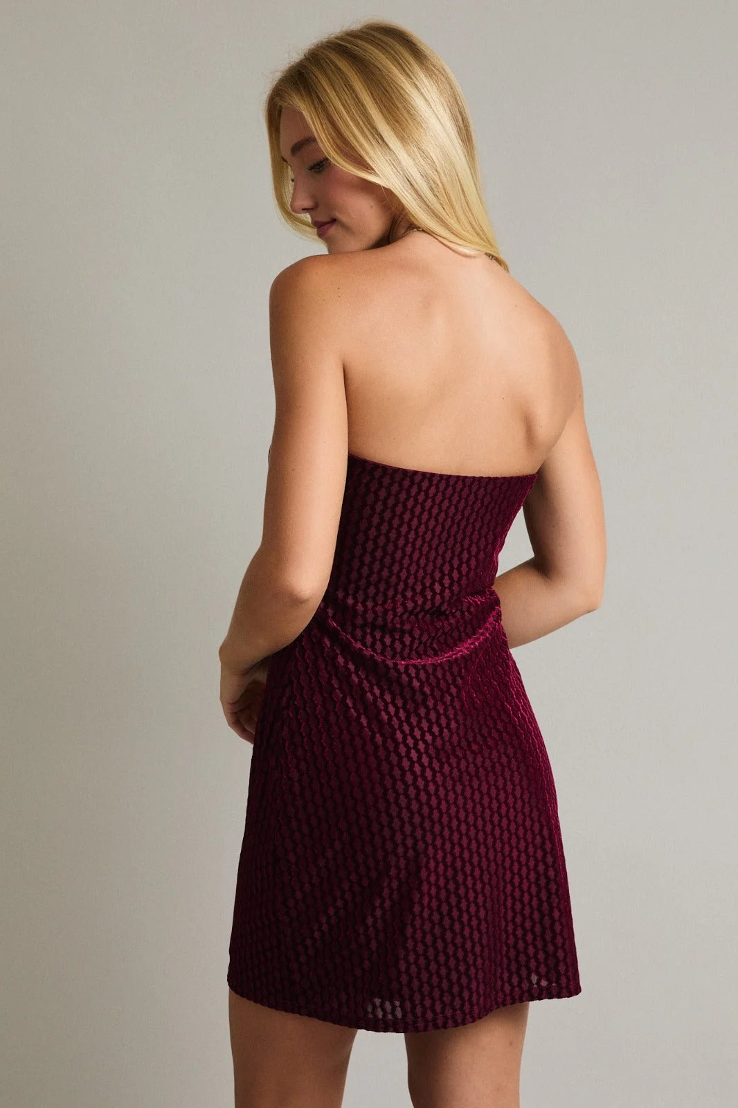 Burgundy strapless velvet mini dress with textured pattern