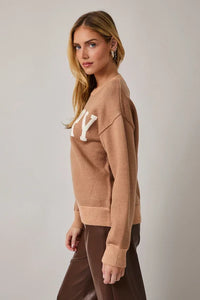 Crew neck long sleeve Merry sweater in camel with ny logo