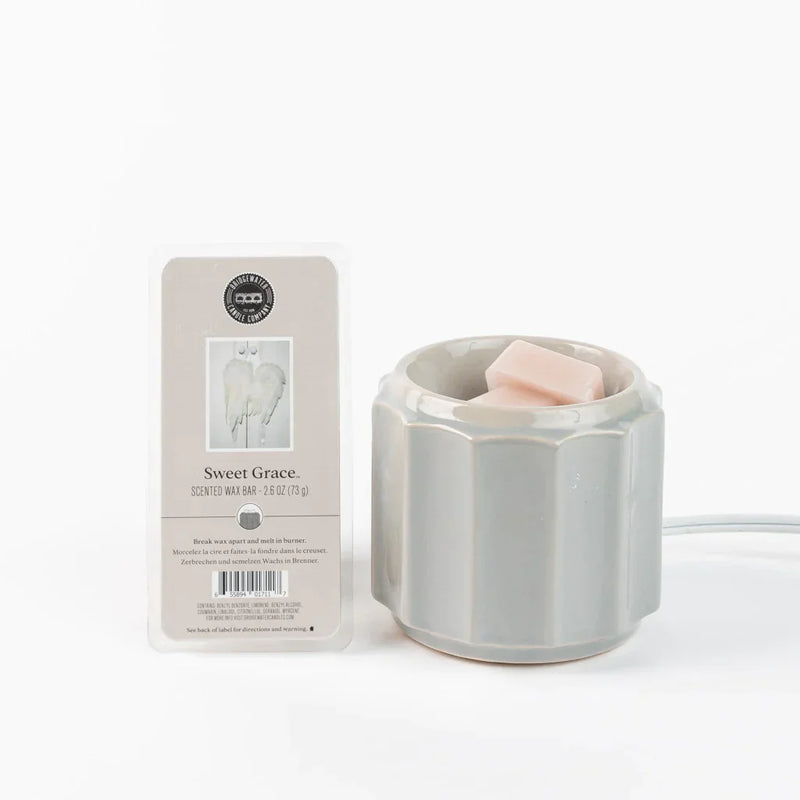 Candles in a container alongside a card for Scented Wax Bar Sweet Grace best seller