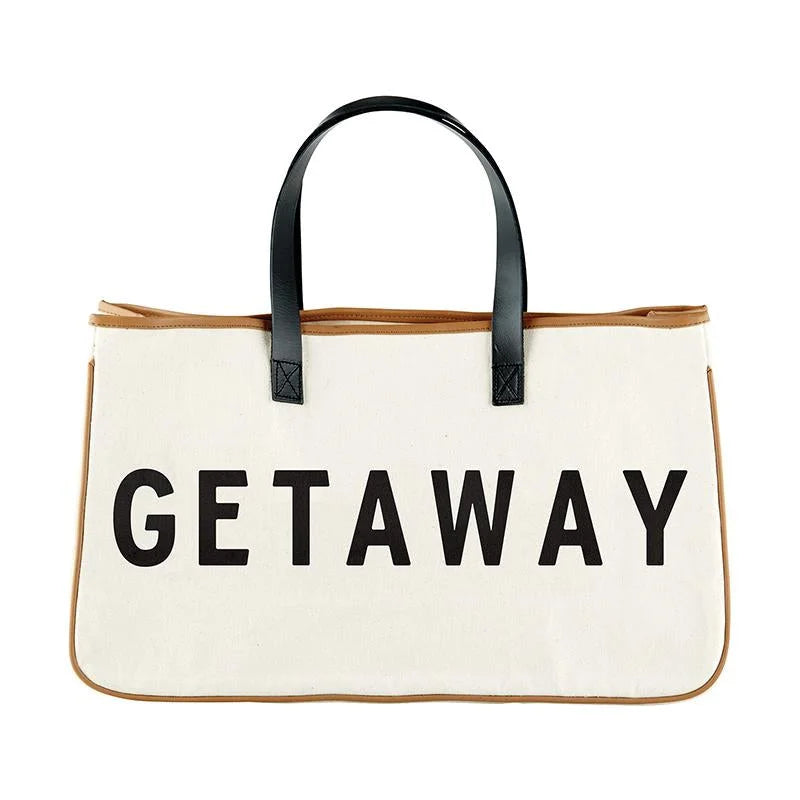 Getaway Canvas Tote displayed prominently in an elegant retail setting