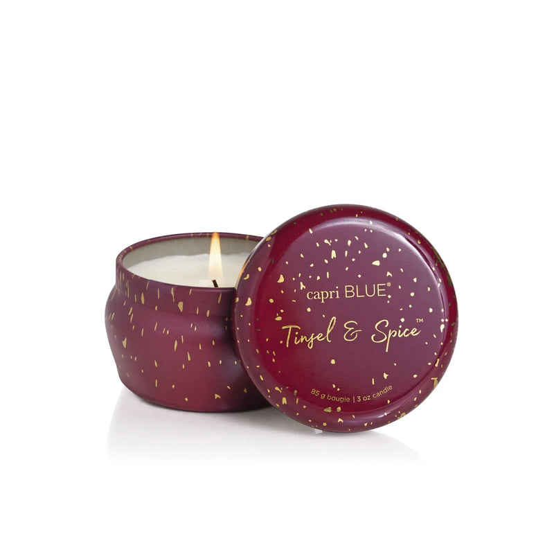 Capri blue Tinsel & Spice Glimmer Mini Tin Candle in a speckled burgundy jar