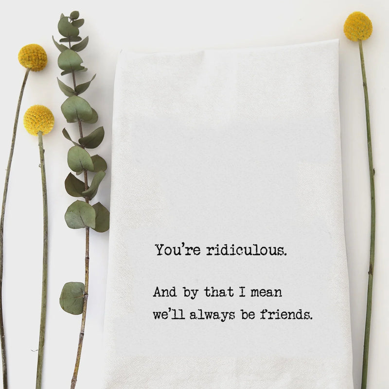 Greeting card with pressed flowers and humorous friendship message beside YOU’RE RIDICULOUS hand towel