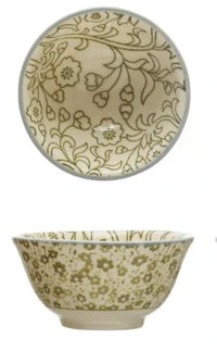 Ceramic stoneware pinch pot featuring intricate floral patterns on a cream background