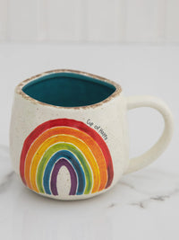 Ceramic ARTISAN RAINBOW COFFEE MUG featuring a vibrant rainbow design, perfect for boho decor