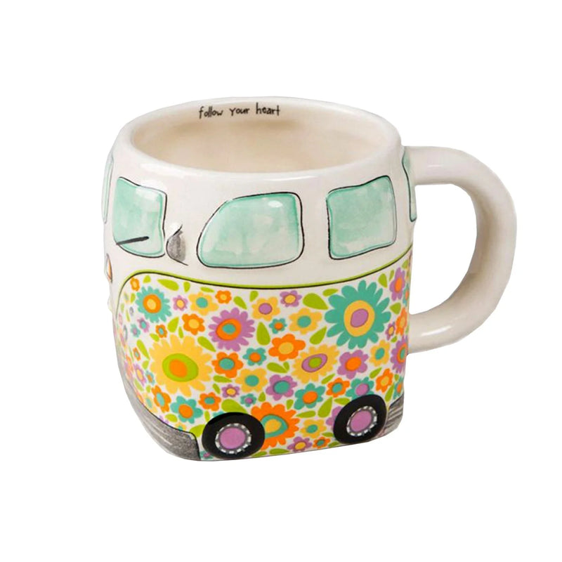 Hand sculpted Ceramic mug featuring a colorful floral-patterned Volkswagen bus design