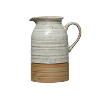 Ceramic stoneware creamer with white upper and tan lower in reactive glaze finish