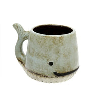 Ceramic whale mug with rustic off-white glaze, perfect for boho home decor