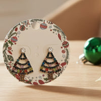 Vibrant rhinestone Christmas tree earrings with festive design