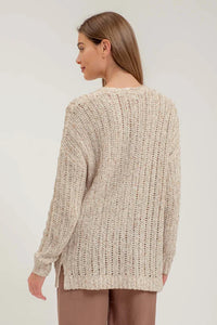 Woman in a Chunky Knit Beige Sweater showcasing the Crochet Knit Cardigan design