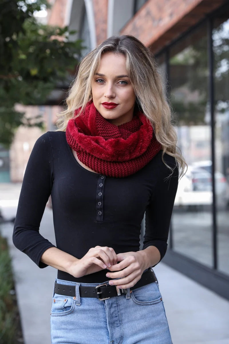 Chunky knit burgundy infinity scarf with faux sherpa lining styled with black top and jeans