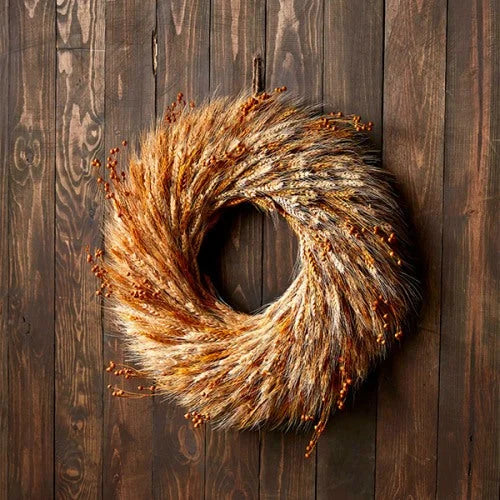 Circular wheat wreath featuring dried stalks and autumn grasses for a cozy fall aesthetic